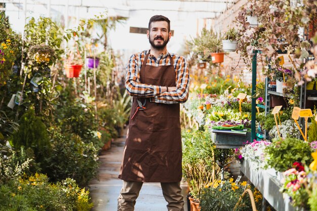 Confident gardener in greenhouse