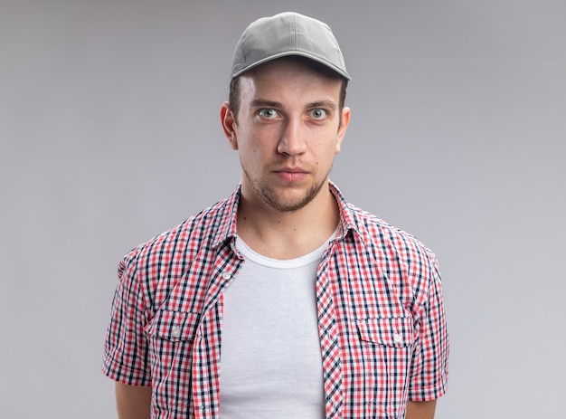 Confident looking at camera young guy cleaner wearing cap isolated on white background