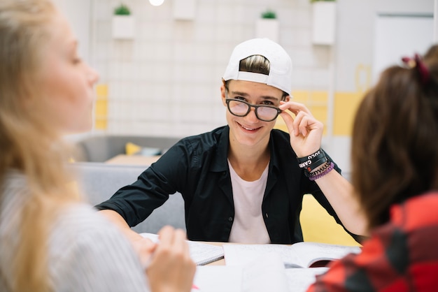 Free photo confident student at table