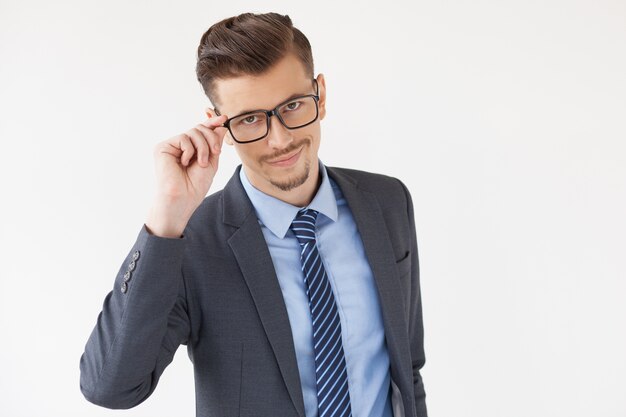 Confident Stylish Business Leader Adjusting Glasses