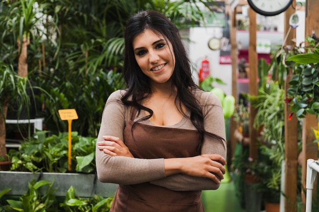 Free Photo confident woman in greenhouse