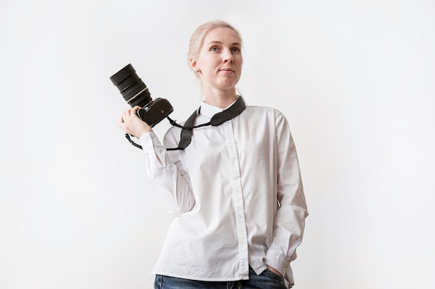 Free Photo confident woman holding a camera photo