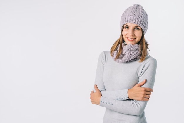 Confident woman in scarf and hat