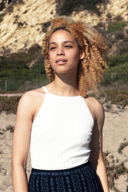 Free photo confident woman in white sleeveless top posing