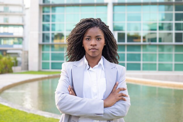 Confident young businesswoman looking at camera