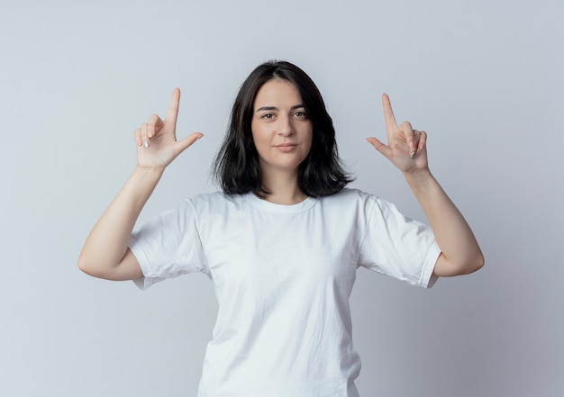 Free Photo confident young pretty caucasian girl pointing with fingers up isolated on white background