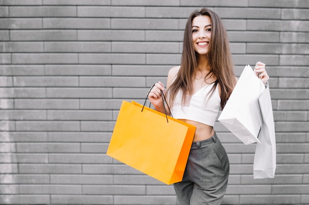 Confident young woman enjoying buying