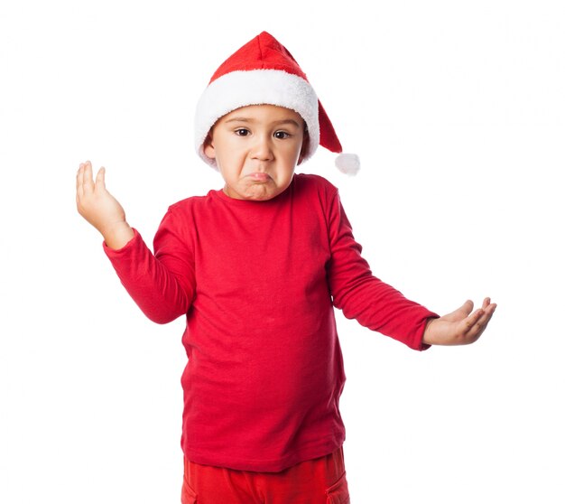 Confused child with christmas hat