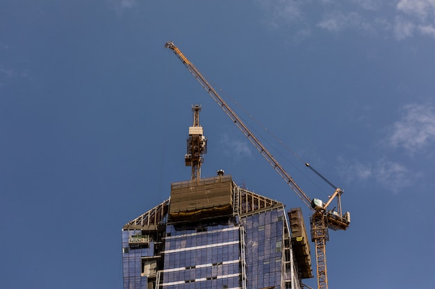 construction activity in Dubai downtown in Dubai, UAE. Dubai is the most populous city and emirate in the United Arab Emirates