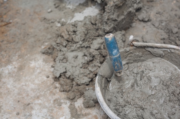 Construction technicians are mixing cement, stone, sand for construction.