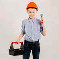 Free photo construction worker holding tool kit