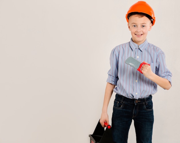 Free photo construction worker holding tool