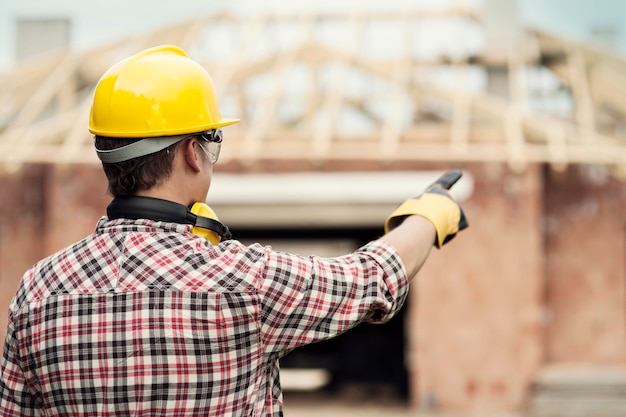 Construction worker pointing at something