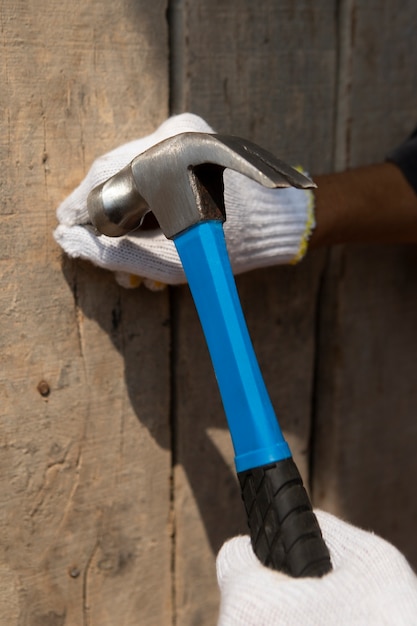 Construction worker using hammer at job site