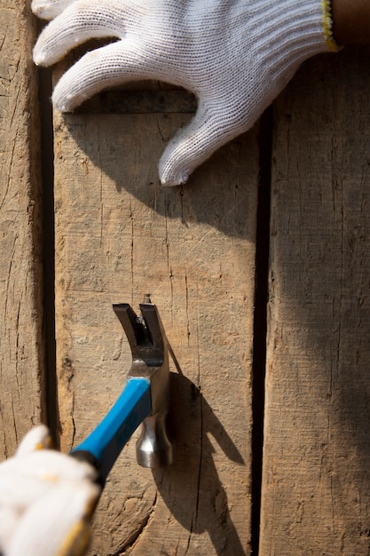 Construction worker using hammer at job site