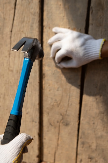 Construction worker using hammer at job site