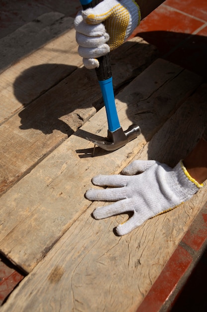 Construction worker using hammer at job site