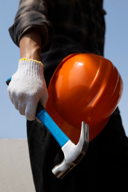 Construction worker using hammer at job site