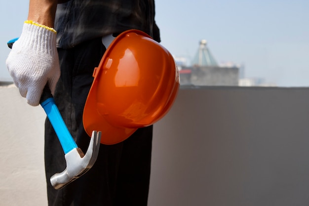 Construction worker using hammer at job site