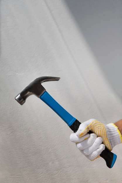 Free Photo construction worker using hammer at job site