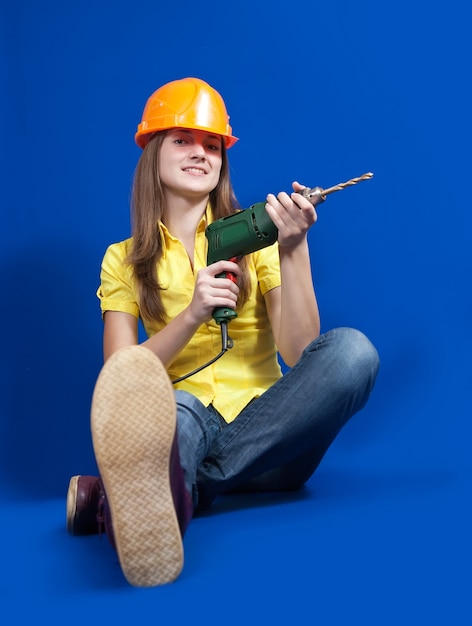 Free photo construction worker  with drill