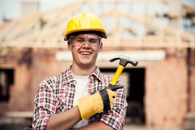 Free photo construction worker with hammer