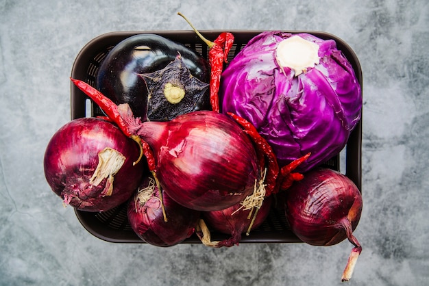 Container of a vegetables on floor