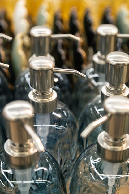 Free photo containers for liquid soap or shampoo with a dispenser is sold in a supermarket