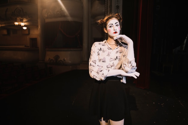 Free Photo contemplated female mime standing on stage