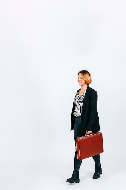 Free photo content businesswoman with case