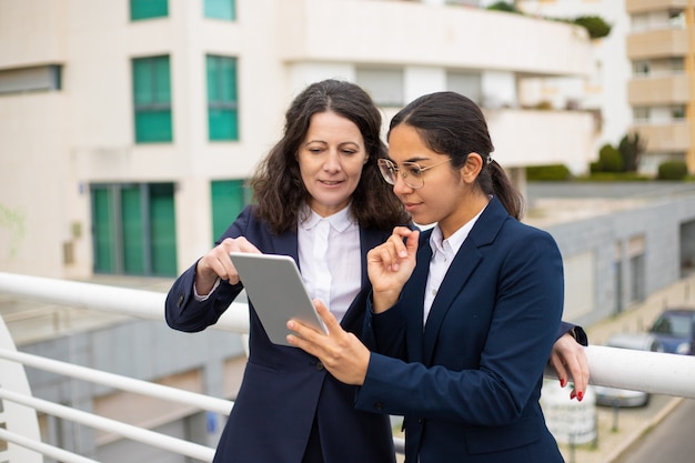 Content businesswomen using tablet pc