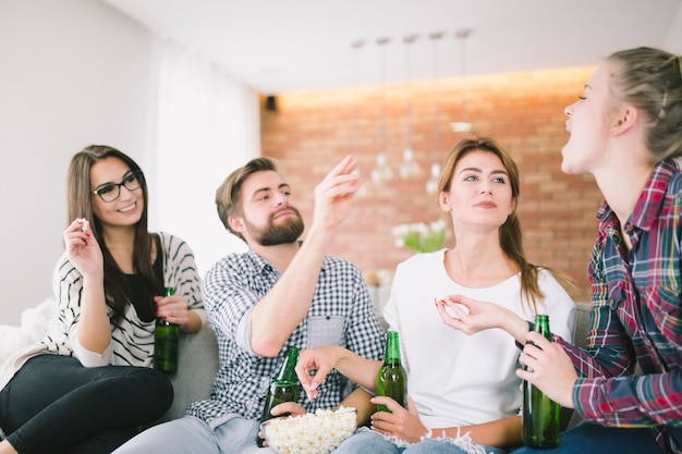 Free photo content friends playing and drinking beer