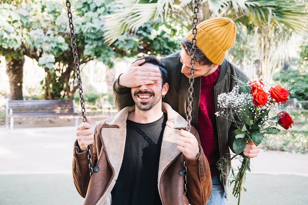 Content gay couple having date in park