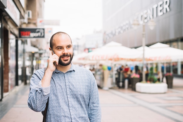 Free photo content man enjoying phone conversation