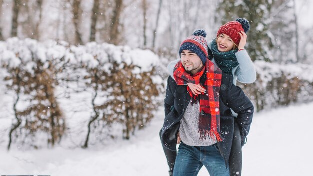 Content romantic couple in winter woods