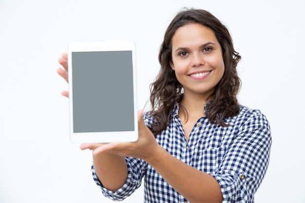 Content woman showing digital tablet