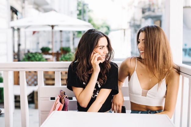 Free photo content women spending time together in mall