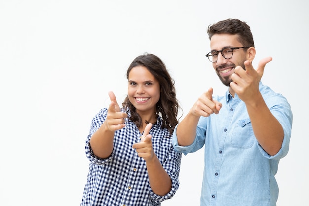 Content young couple showing finger guns