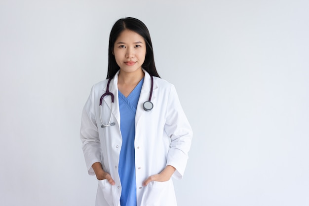 Content young female doctor posing at camera