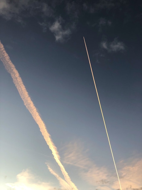 Free photo contrails of an airplane up in the sky