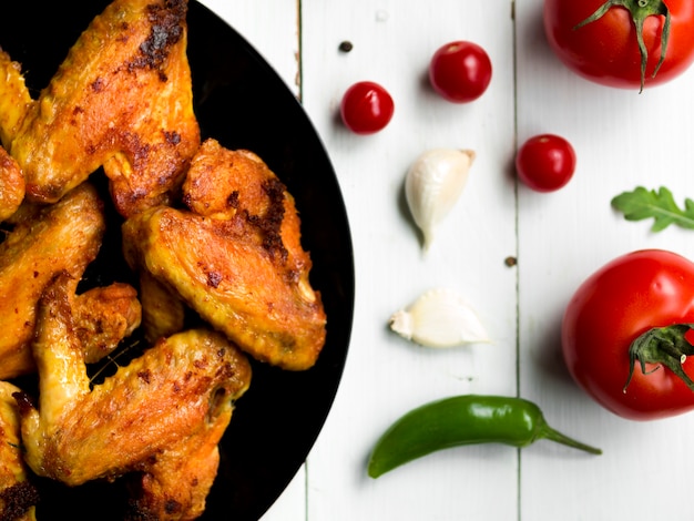 Cooked chicken wings with herbs