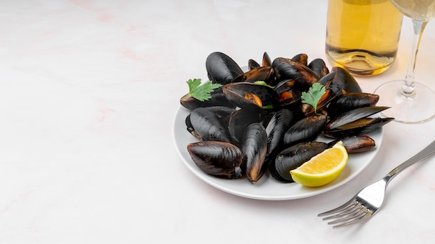 Cooked mussels and cutlery