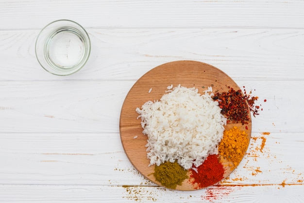 Free photo cooked rice with spices on wooden board