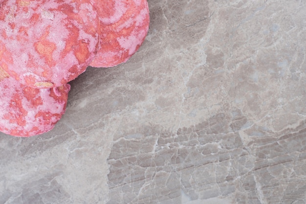 Cookies bundled together in a small pile on marble surface