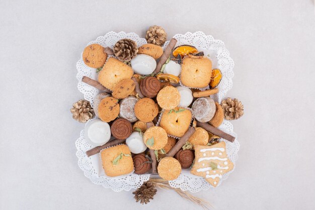 Cookies on rope in plate on white table