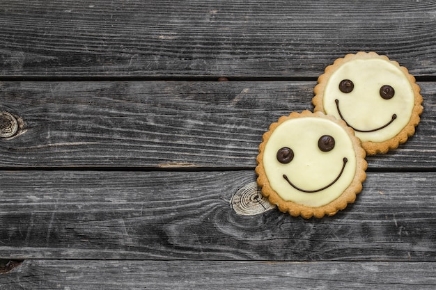 Free photo cookies smile on a beautiful wooden wall