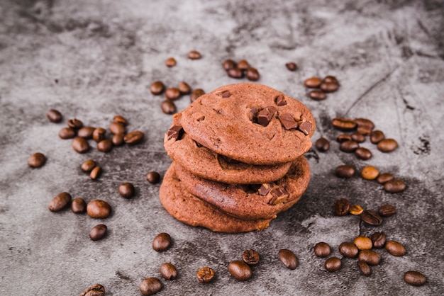 Cookies stack surrounded with roasted coffee beans