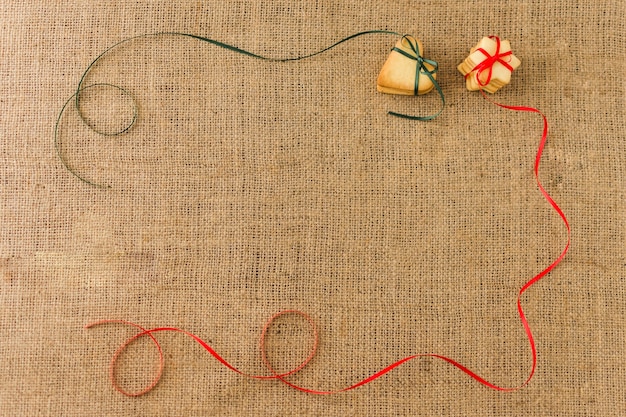 Cookies with colourful ribbons on table