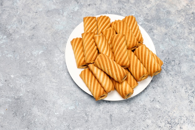 Cookies with jam filling on concrete surface