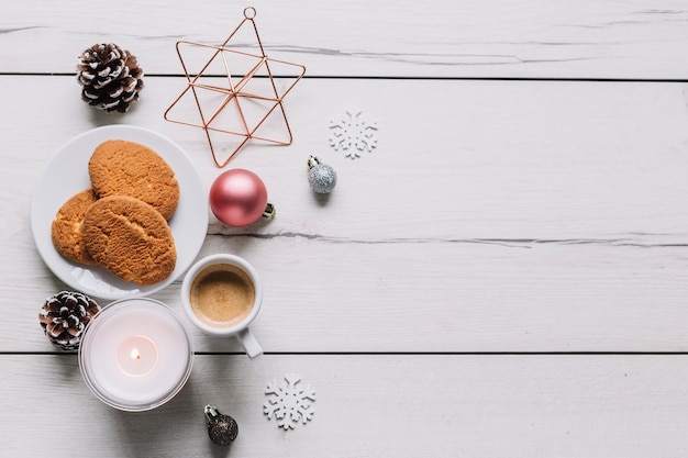 Cookies with shiny baubles on table 